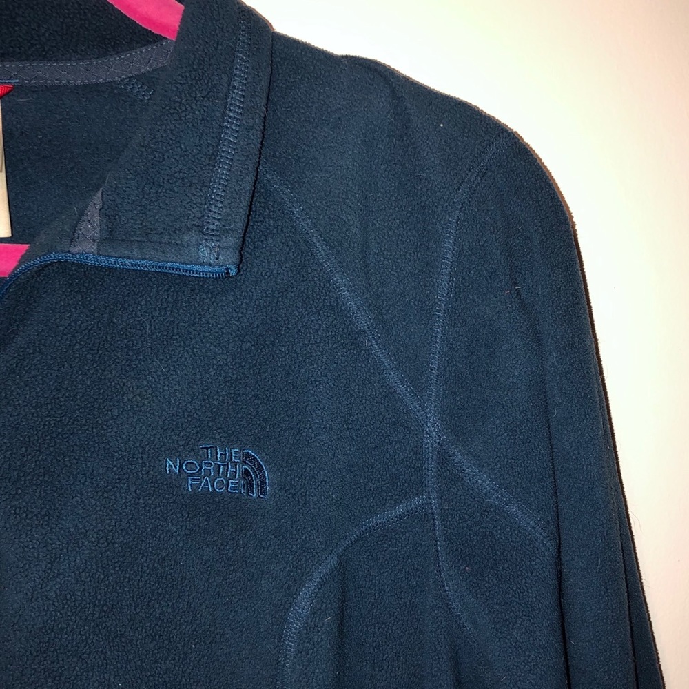 Navy blue women’s NorthFace fleece jacket
